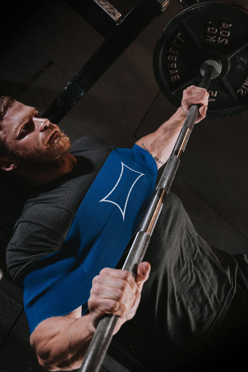 Male wearing blue sling shot while benching - Shop Sling Shot - Mobile Banner