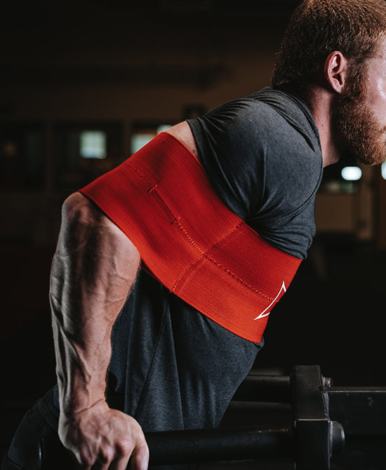 Male using sling shot during dips