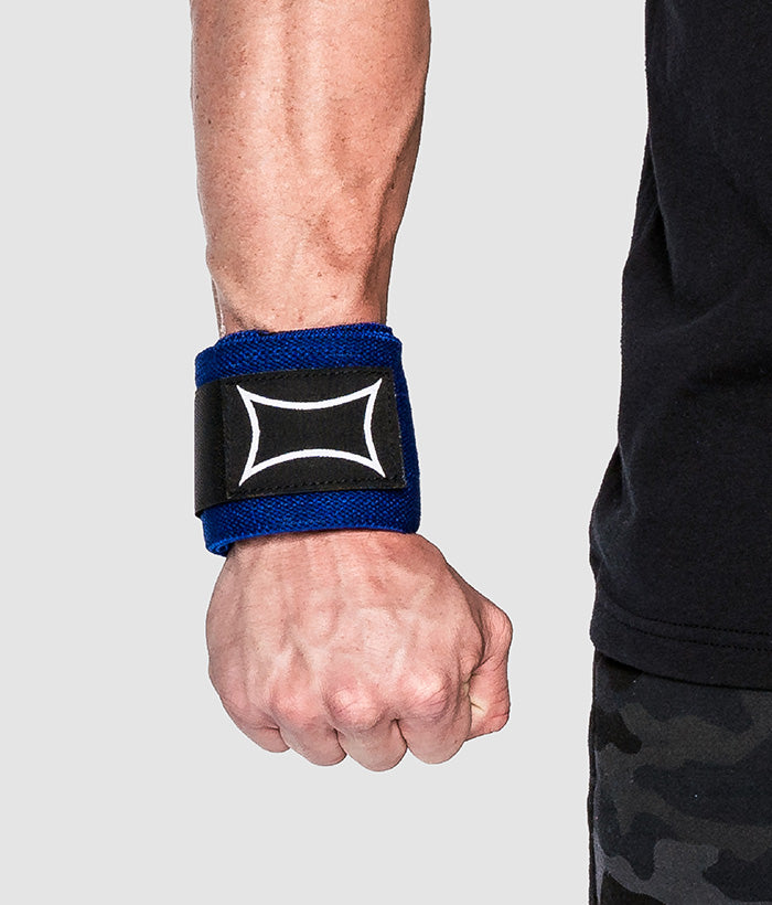 male wearing blue wrist wraps