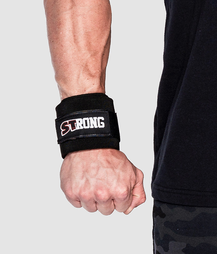 male wearing black wrist wraps
